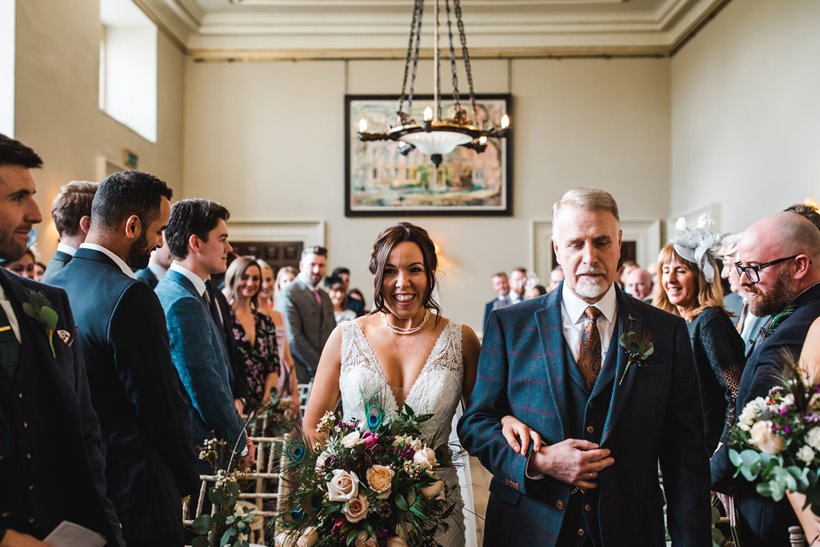 Bride walking down aisle with father