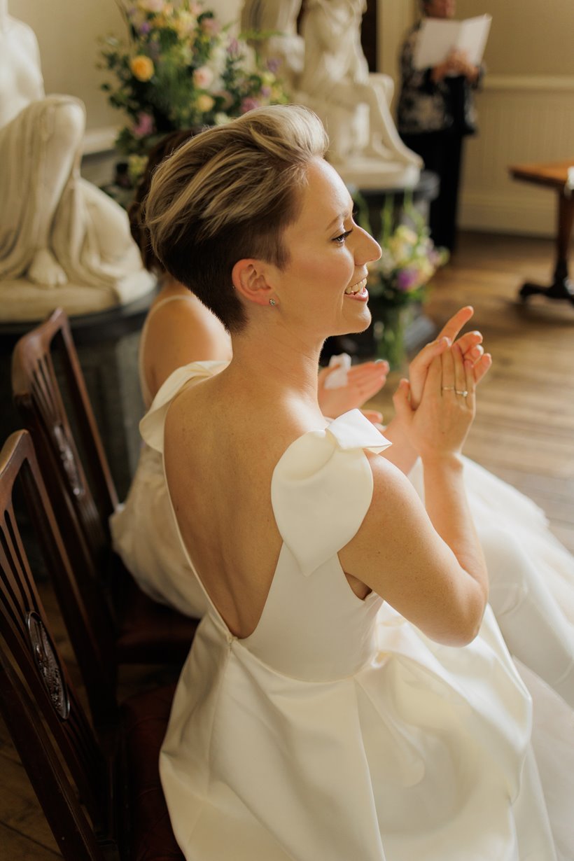 happy bride clapping at her wedding ceremony