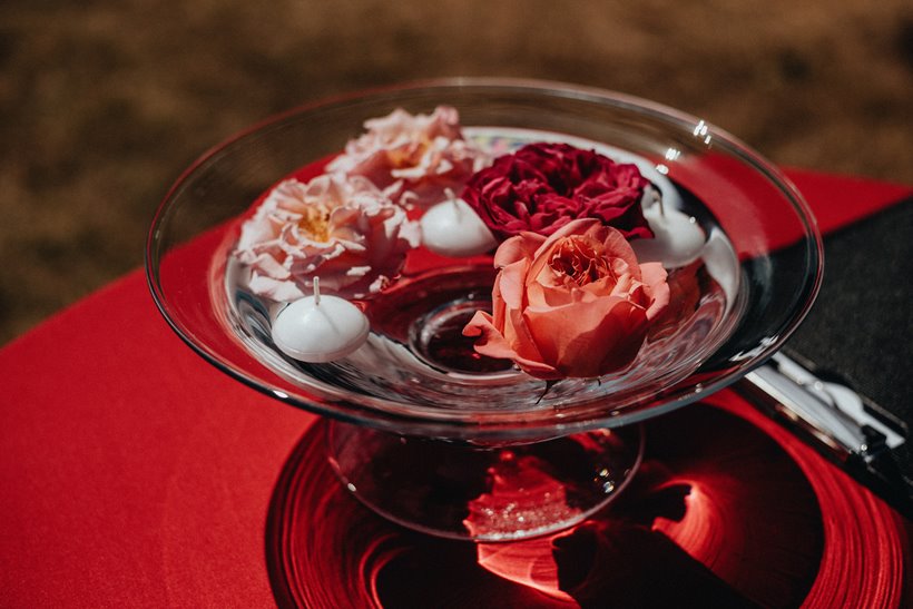 bowl of pink and red wedding flowers