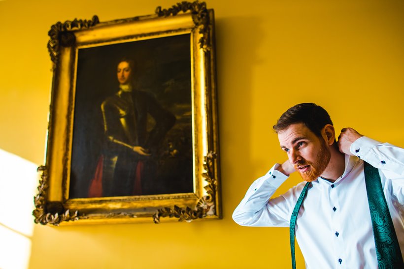 Groom getting ready for ceremony of his weekend wedding