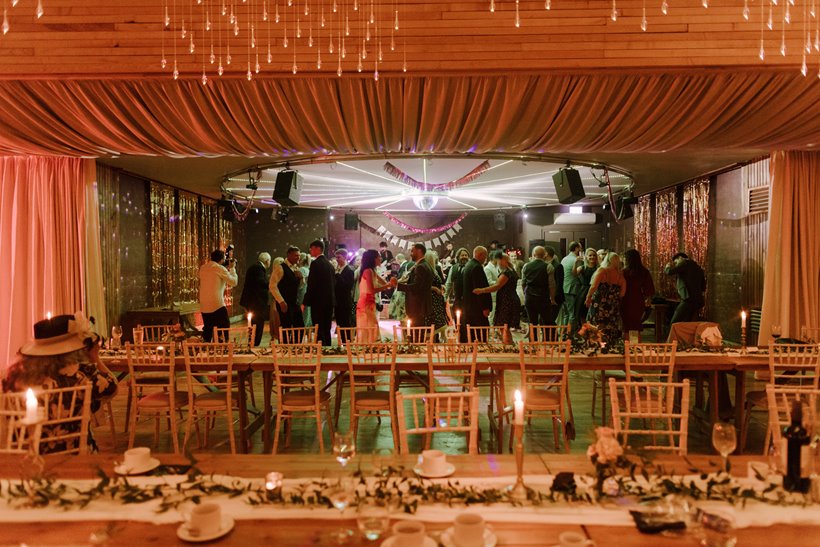 Party wedding venue with cool lighting and guests dancing and having fun with funktion one soundsystem