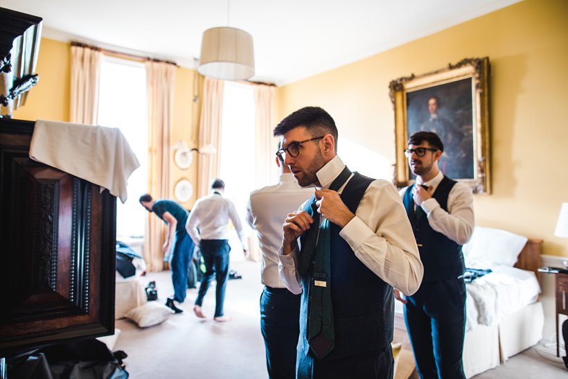 Groomsmen getting ready for weekend wedding