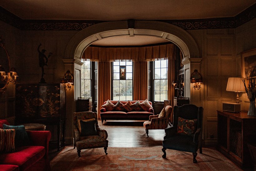 Cosy drawing room at autumnal mansion house wedding venue in the countryside 