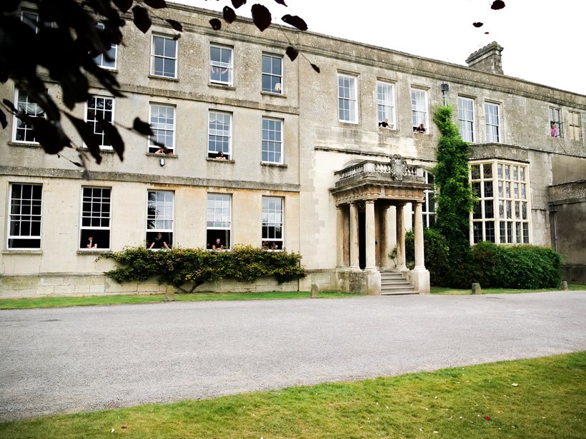 Elmore court mansion house with all the housekeepers looking out of the bedroom windows