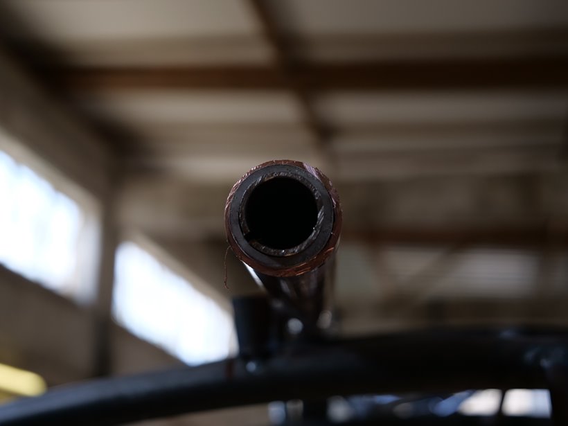 Copper pipe up close is part of a bespoke water sculpture by Giles Rayner for rewilding country estate in the cotswolds