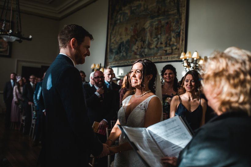 Beautiful wedding ceremony sun light hits brides face