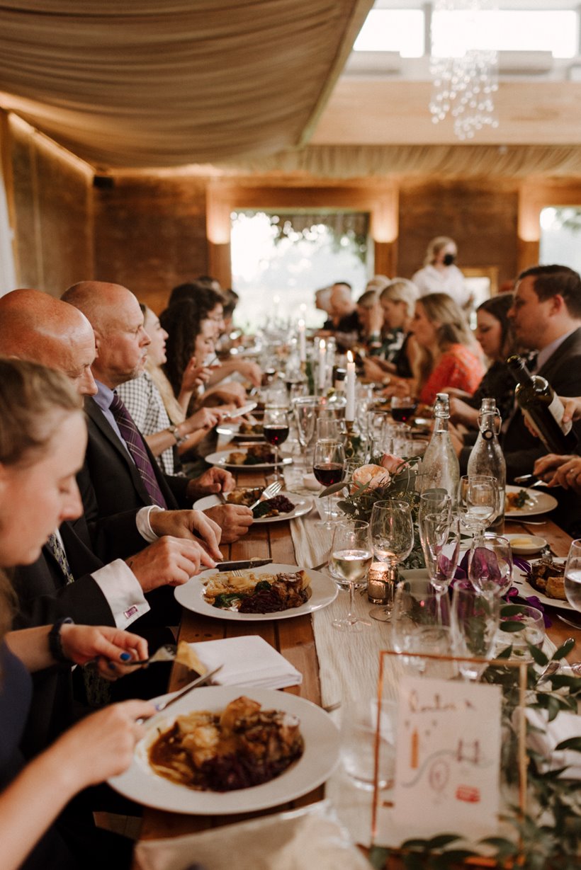 wedding guests enjoying the best wedding food ever at elmore court in the cotswolds