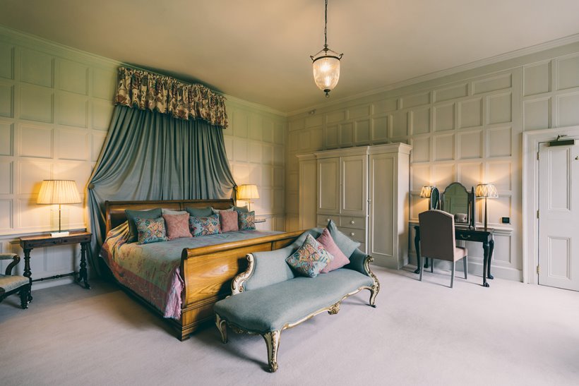 The smoking room white painted panelled room full of light with huge emperor bed could be your bridal suite or guest accommodation