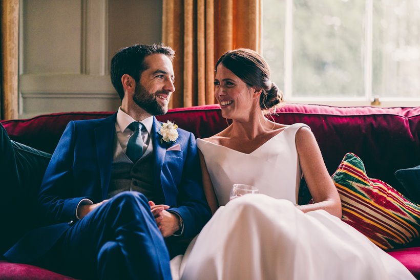 wedding planning couple smile at each other